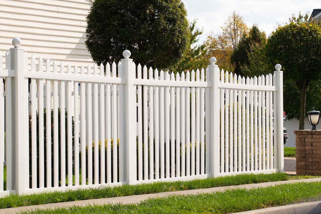 White picket fences at corner of house