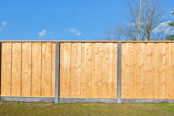 wood fence with clear blue sky
